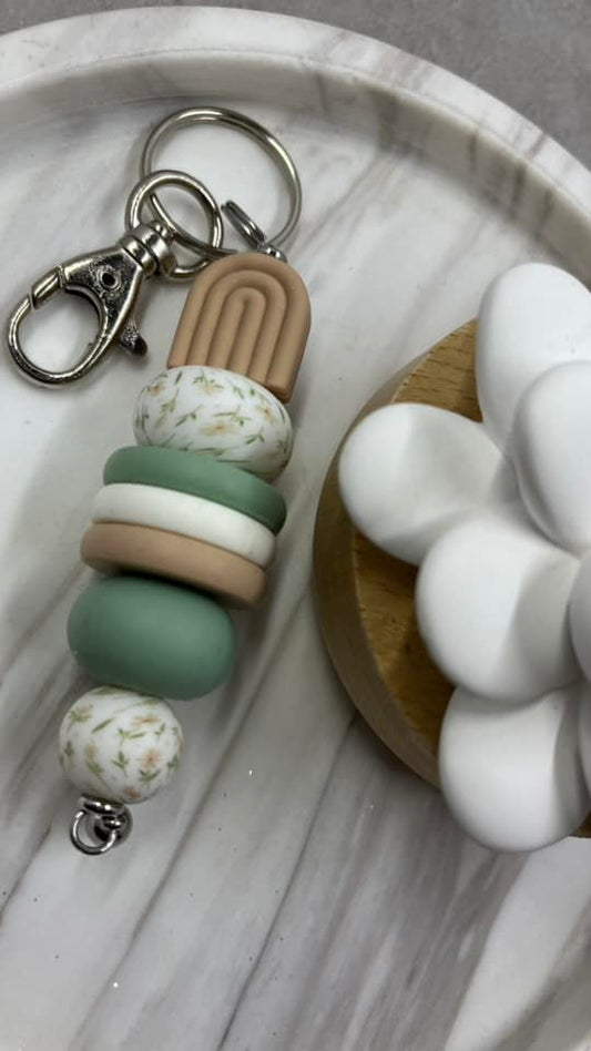 Nude arch with floral print keychain