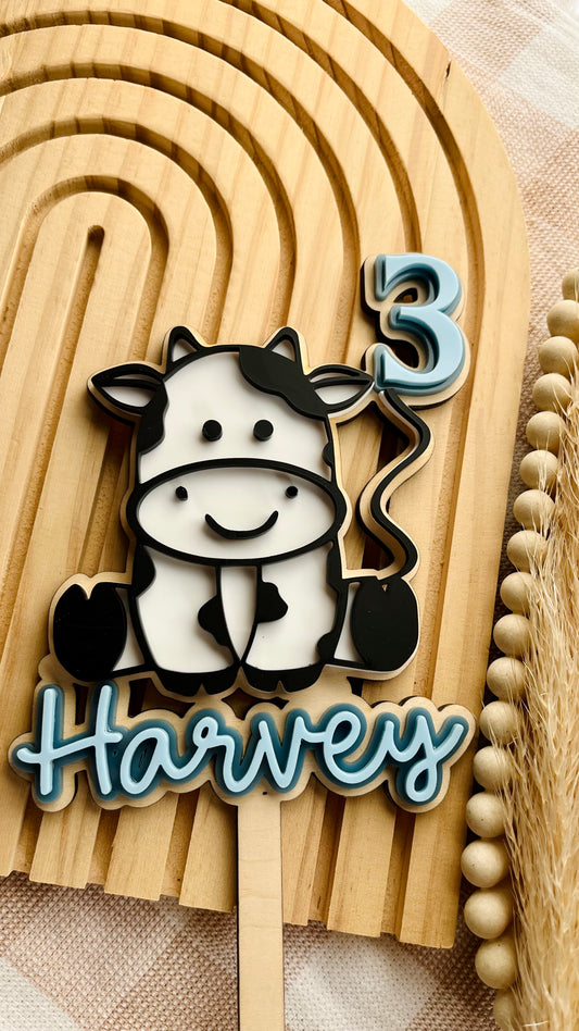 Cow and number cake topper